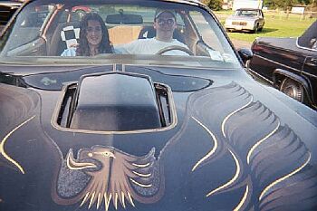 Me and Kim in the summer of 2000 in my old Trans Am
